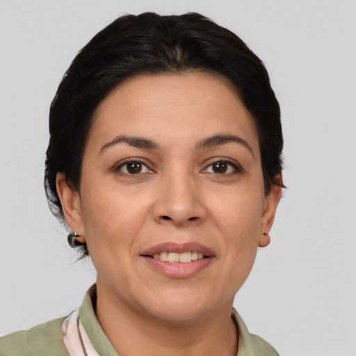 Joyful white adult female with medium  brown hair and brown eyes