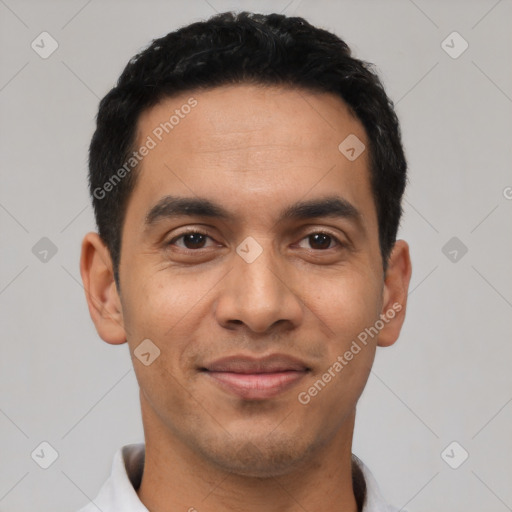 Joyful latino young-adult male with short  black hair and brown eyes