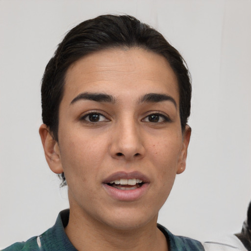 Joyful white young-adult female with short  brown hair and brown eyes