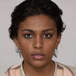 Neutral black young-adult female with short  brown hair and brown eyes