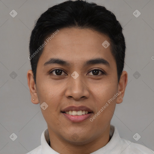 Joyful latino young-adult male with short  black hair and brown eyes