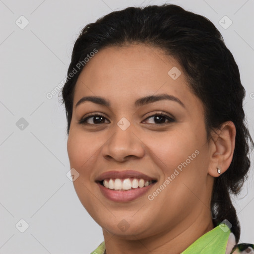 Joyful latino young-adult female with medium  brown hair and brown eyes