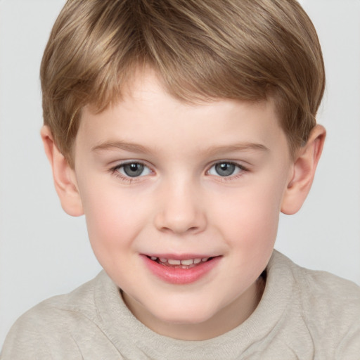 Joyful white child male with short  brown hair and grey eyes