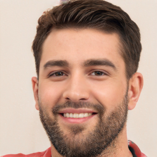 Joyful white young-adult male with short  black hair and brown eyes