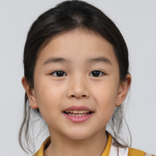 Joyful asian child female with medium  brown hair and brown eyes