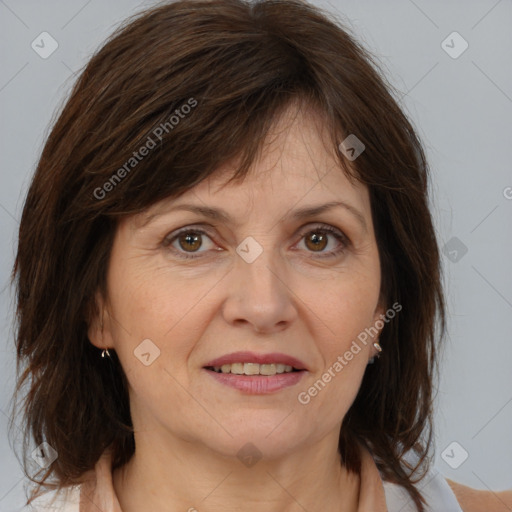 Joyful white adult female with medium  brown hair and brown eyes