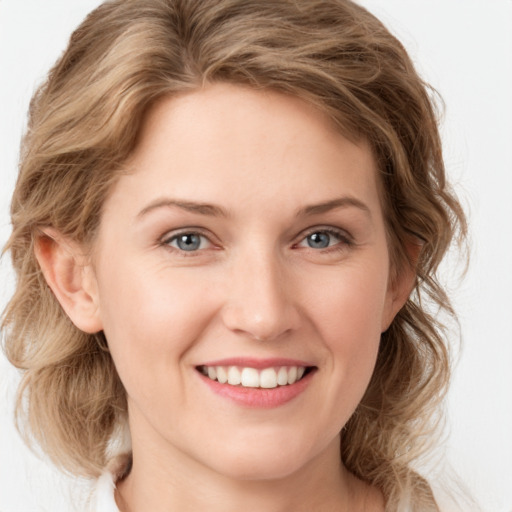 Joyful white young-adult female with medium  brown hair and green eyes