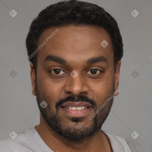 Joyful black young-adult male with short  black hair and brown eyes
