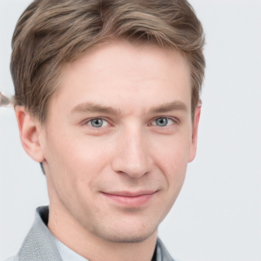 Joyful white young-adult male with short  brown hair and grey eyes