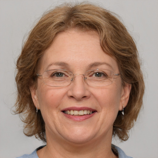 Joyful white middle-aged female with medium  brown hair and blue eyes