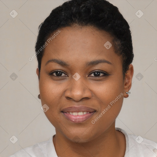 Joyful black young-adult female with short  black hair and brown eyes