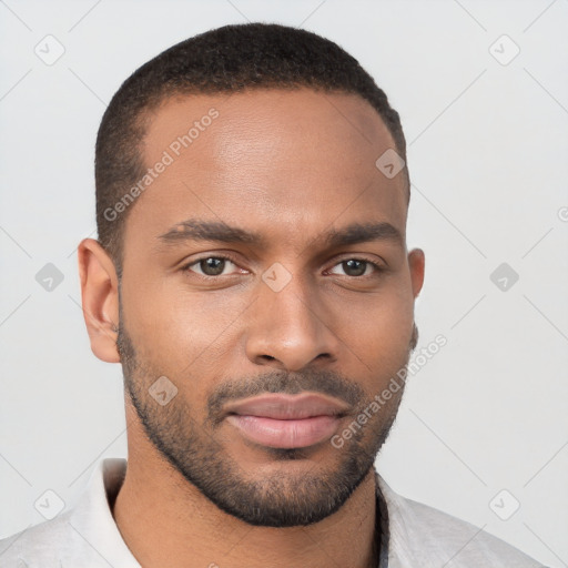 Joyful black young-adult male with short  brown hair and brown eyes