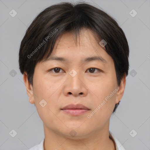 Neutral asian adult male with short  brown hair and brown eyes