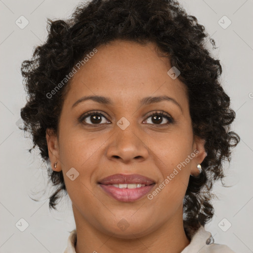 Joyful black adult female with medium  brown hair and brown eyes