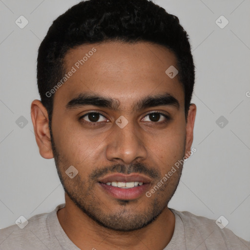 Joyful latino young-adult male with short  black hair and brown eyes