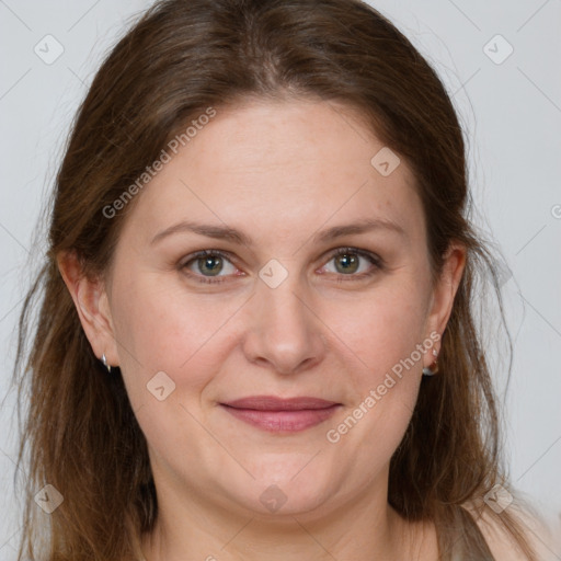 Joyful white adult female with medium  brown hair and grey eyes