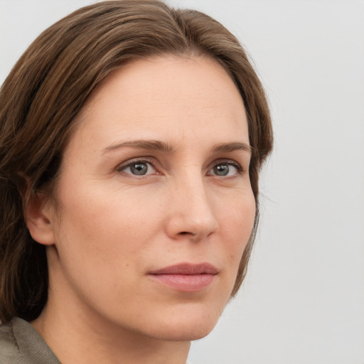 Neutral white young-adult female with medium  brown hair and grey eyes