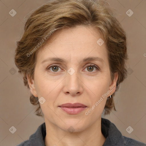 Joyful white adult female with medium  brown hair and grey eyes