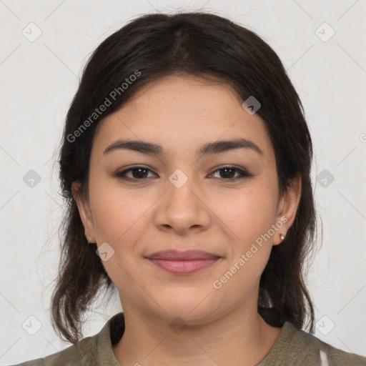 Joyful latino young-adult female with medium  brown hair and brown eyes