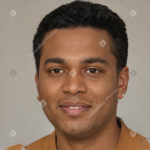 Joyful black young-adult male with short  black hair and brown eyes