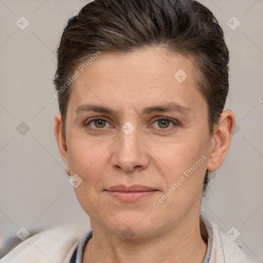 Joyful white adult female with short  brown hair and brown eyes