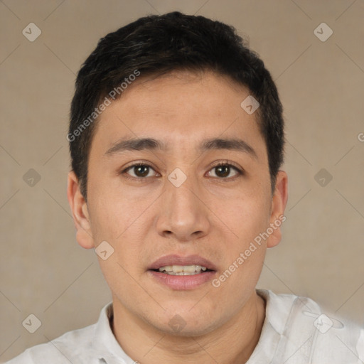 Joyful white young-adult male with short  black hair and brown eyes