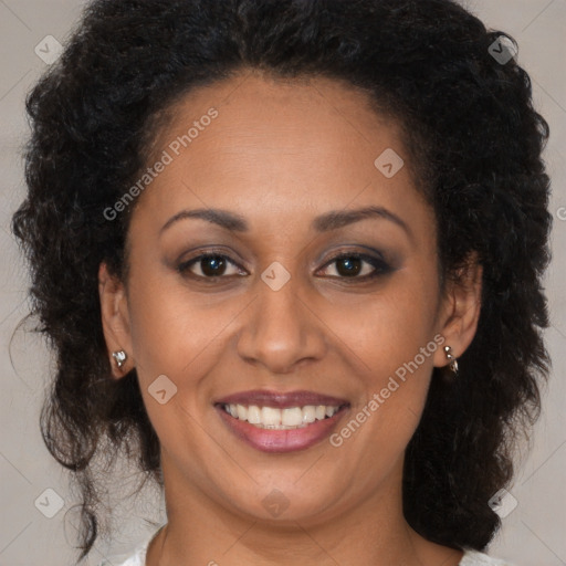 Joyful black young-adult female with long  brown hair and brown eyes