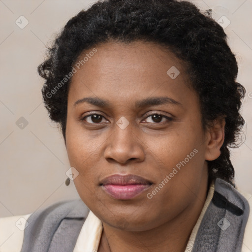 Joyful black adult female with short  brown hair and brown eyes