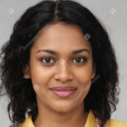 Joyful black young-adult female with long  brown hair and brown eyes