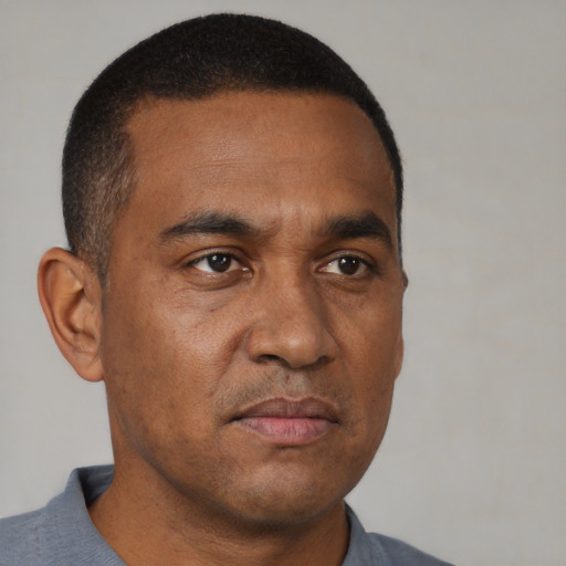 Neutral black adult male with short  brown hair and brown eyes