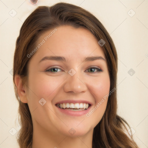 Joyful white young-adult female with long  brown hair and green eyes