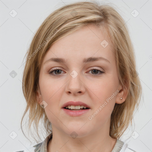 Joyful white young-adult female with medium  brown hair and blue eyes