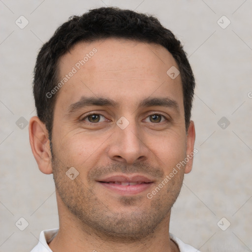 Joyful white young-adult male with short  brown hair and brown eyes