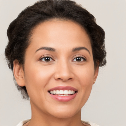 Joyful white young-adult female with medium  brown hair and brown eyes