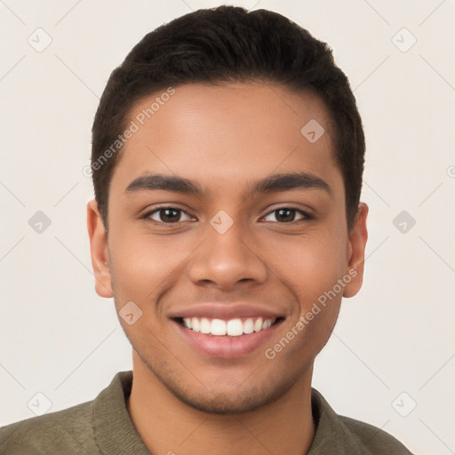 Joyful latino young-adult male with short  brown hair and brown eyes