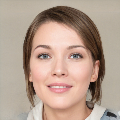 Joyful white young-adult female with medium  brown hair and blue eyes