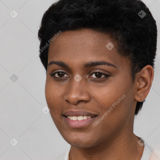 Joyful black young-adult female with short  black hair and brown eyes