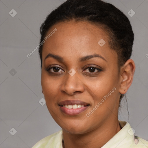 Joyful black young-adult female with short  brown hair and brown eyes