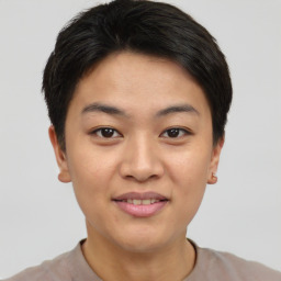 Joyful asian young-adult female with short  brown hair and brown eyes