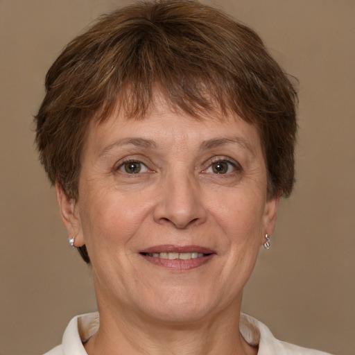 Joyful white adult female with short  brown hair and brown eyes