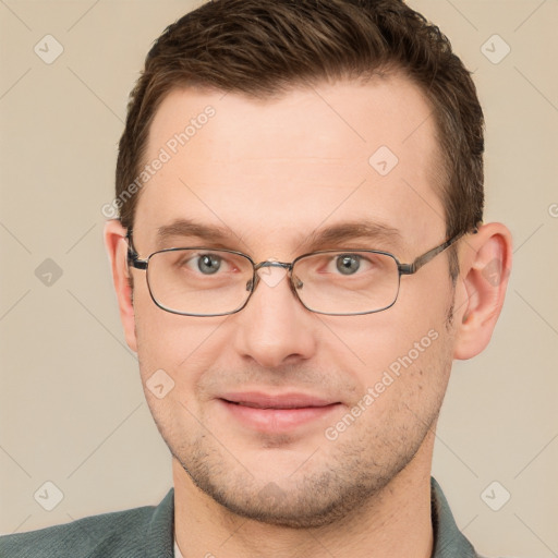 Joyful white young-adult male with short  brown hair and grey eyes