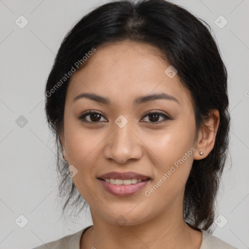 Joyful latino young-adult female with medium  brown hair and brown eyes