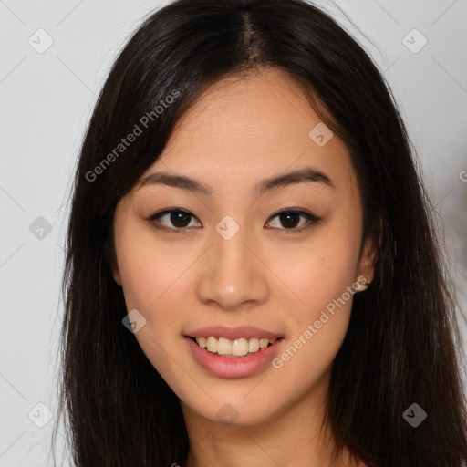 Joyful asian young-adult female with long  brown hair and brown eyes