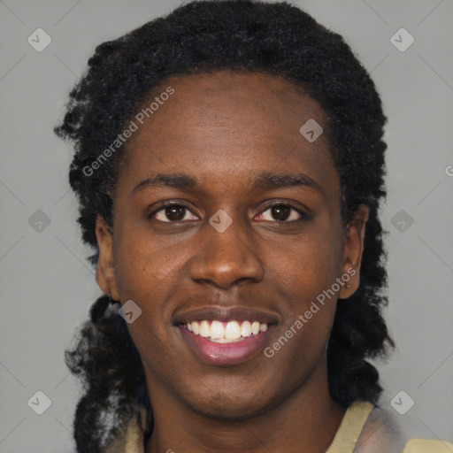 Joyful black young-adult female with short  black hair and brown eyes