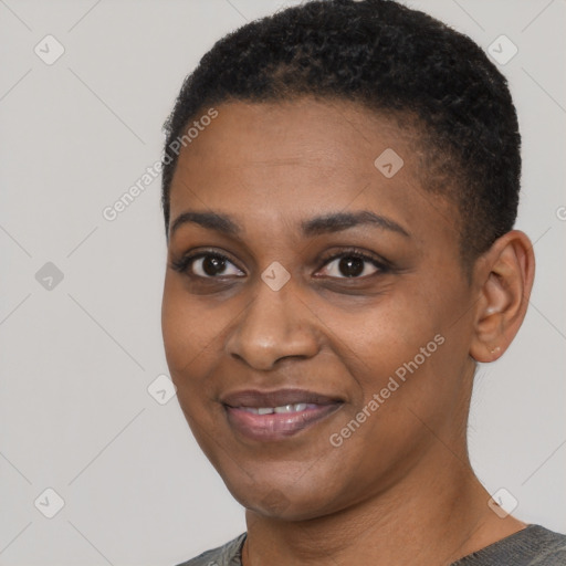 Joyful black young-adult female with short  black hair and brown eyes