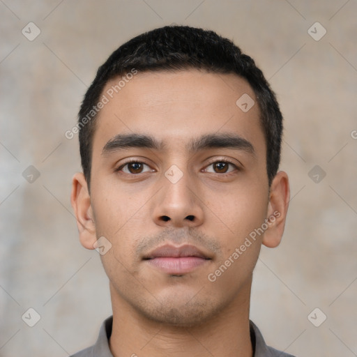 Neutral latino young-adult male with short  black hair and brown eyes