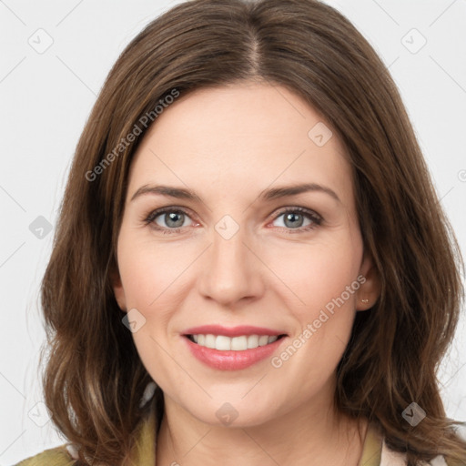 Joyful white young-adult female with medium  brown hair and green eyes