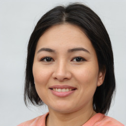 Joyful asian young-adult female with medium  brown hair and brown eyes