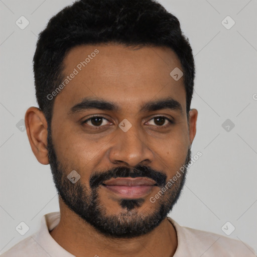 Joyful black young-adult male with short  black hair and brown eyes