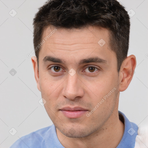 Joyful white young-adult male with short  brown hair and brown eyes